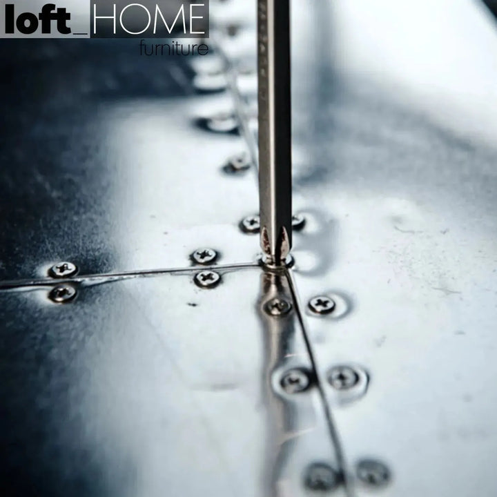 Industrial genuine leather 3 seater sofa silver aircraft in close up details.