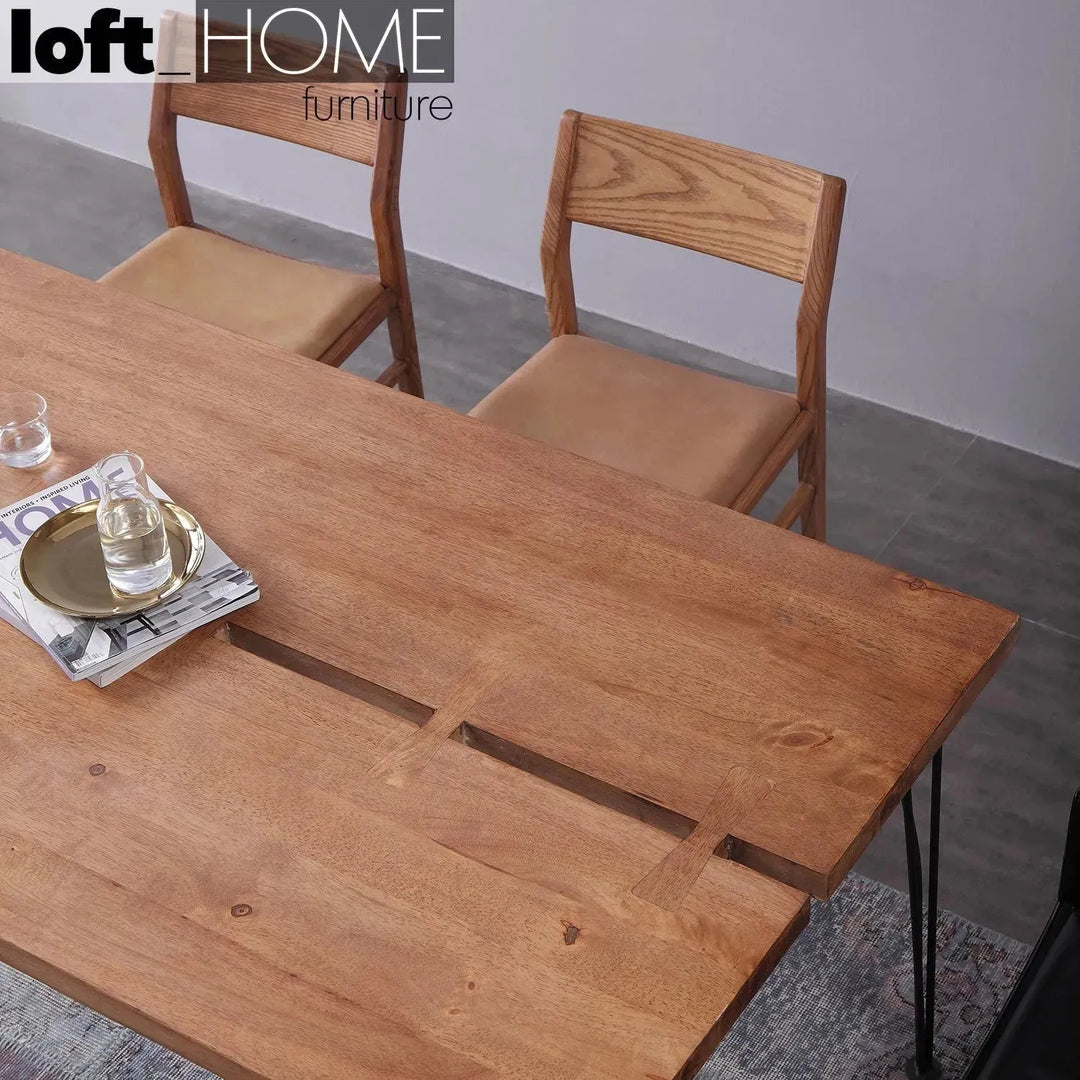 Industrial rubber wood dining table dovetail with context.