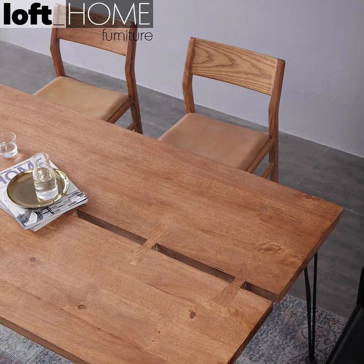 Industrial rubber wood dining table dovetail with context.