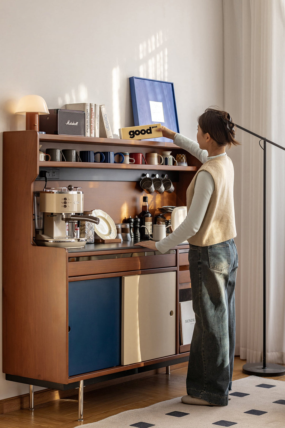 Modern wooden storage cabinets and bookshelves styled in a warm living space, showcasing organized display and refined storage solutions for Singapore homes.