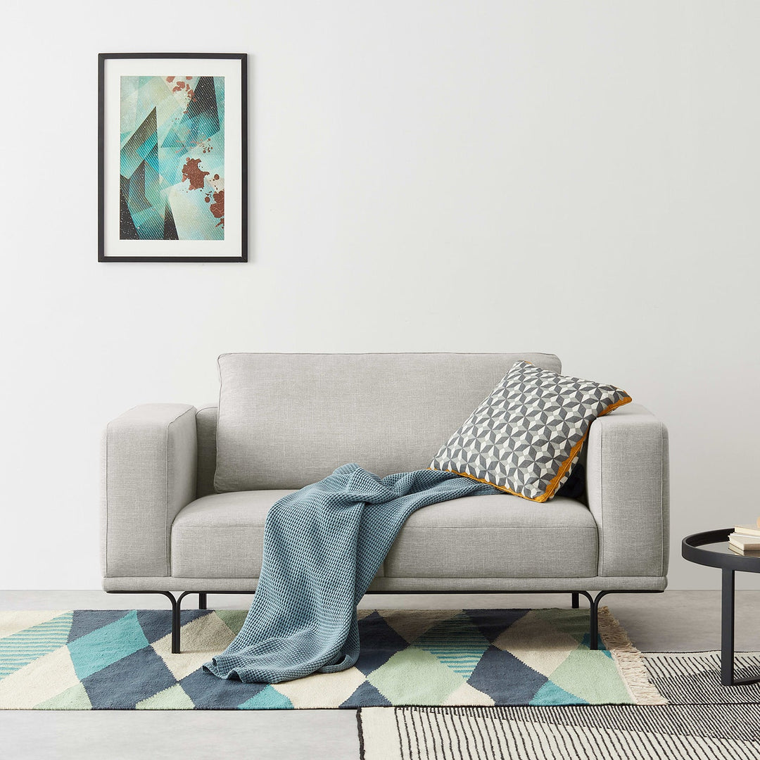 Loft Home 2-seater minimalist sofa with clean lines and light grey upholstery, perfect for modern and functional living spaces in the 2-Seater Minimalist Sofas collection.