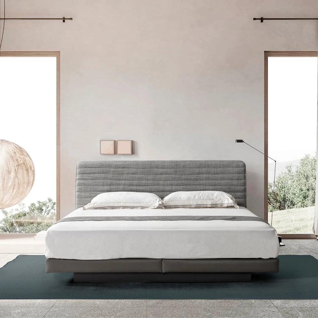 Modern bedroom with a grey upholstered queen-size bed frame. Explore the Asia queen-size bed frame collection at Loft Home Furniture.