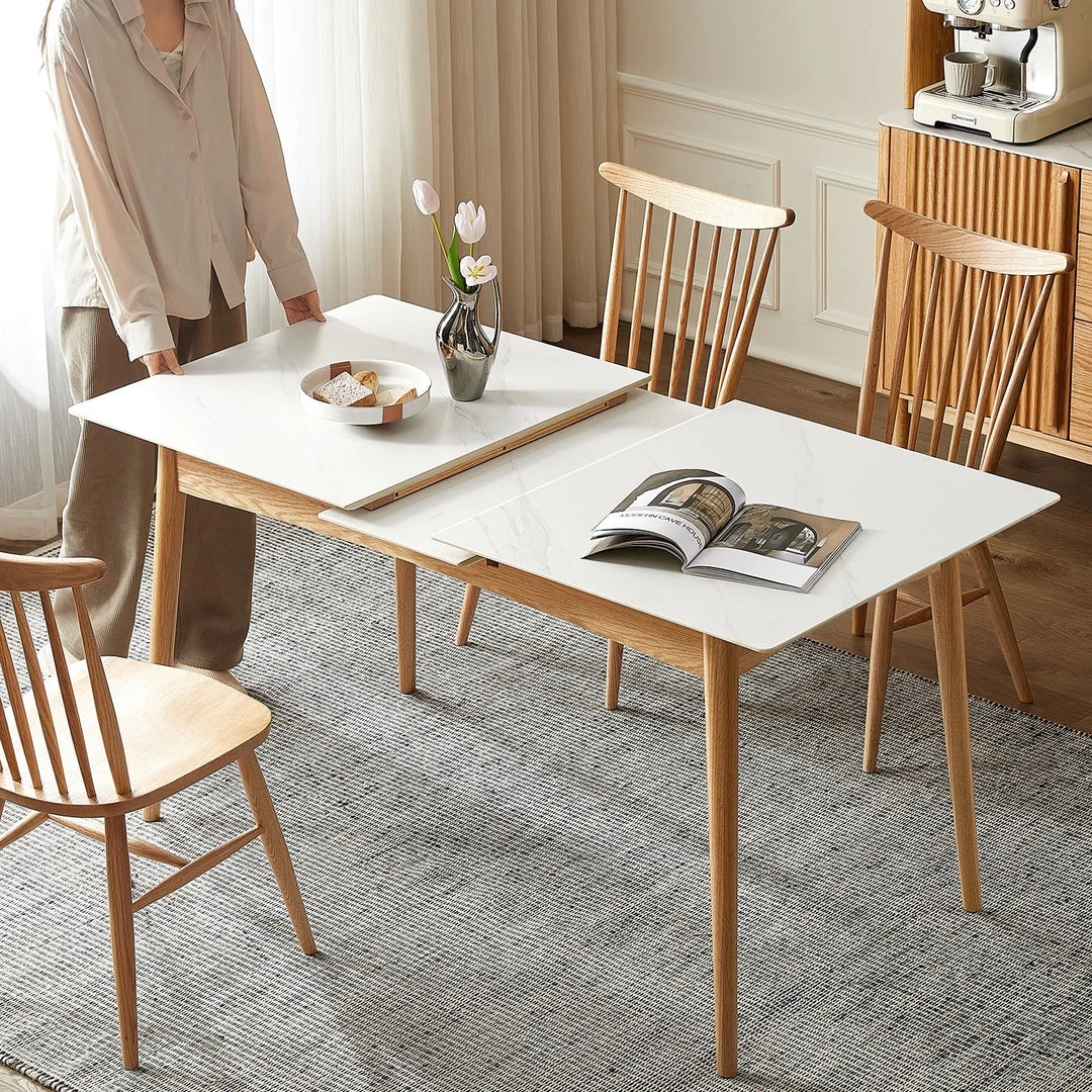 Modern dining room with an extendable dining table and wooden chairs. Explore extendable dining tables at Loft Home Furniture.