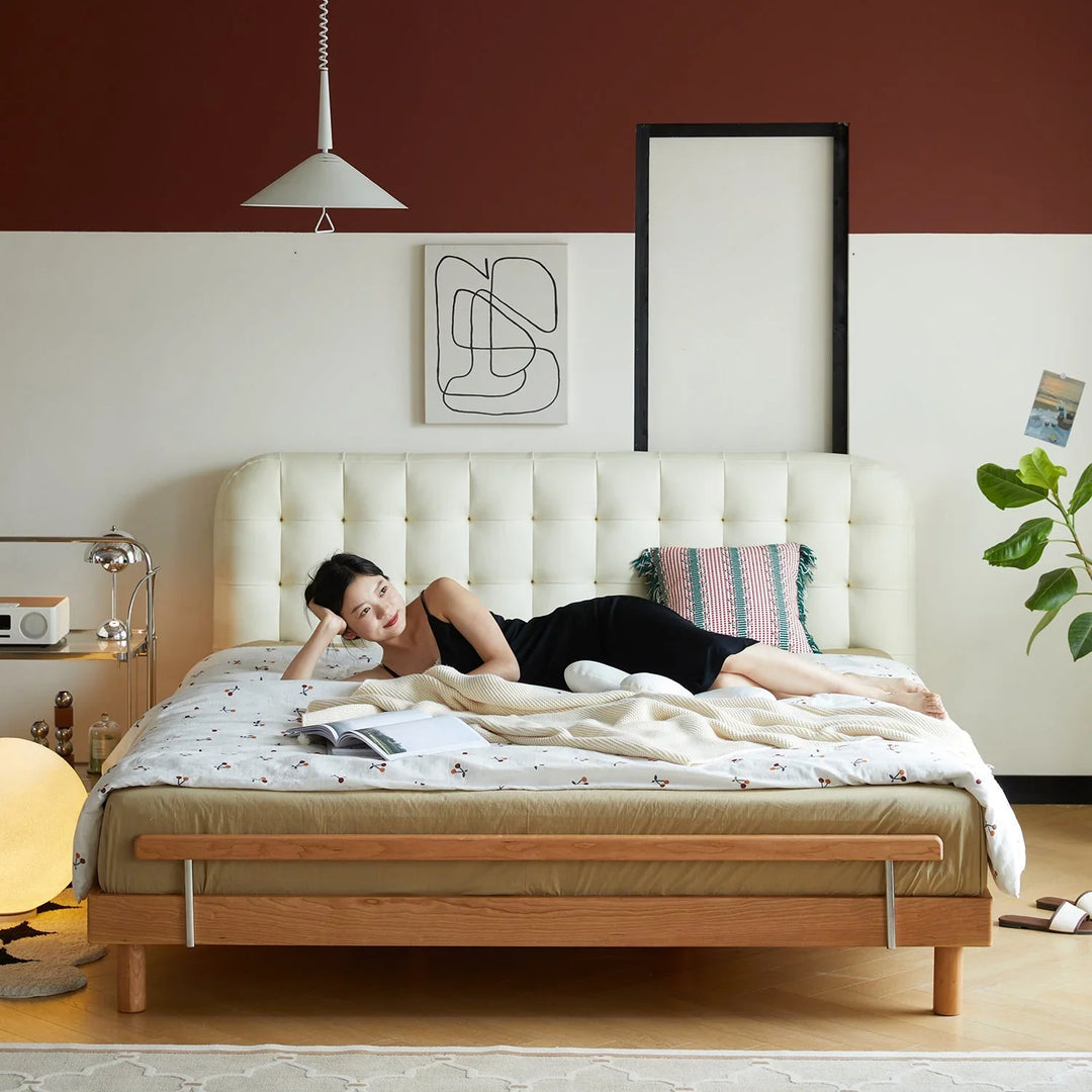Modern bedroom featuring a microfiber leather bed frame, cozy bedding, minimalist decor, and a relaxing ambiance with soft lighting and greenery.