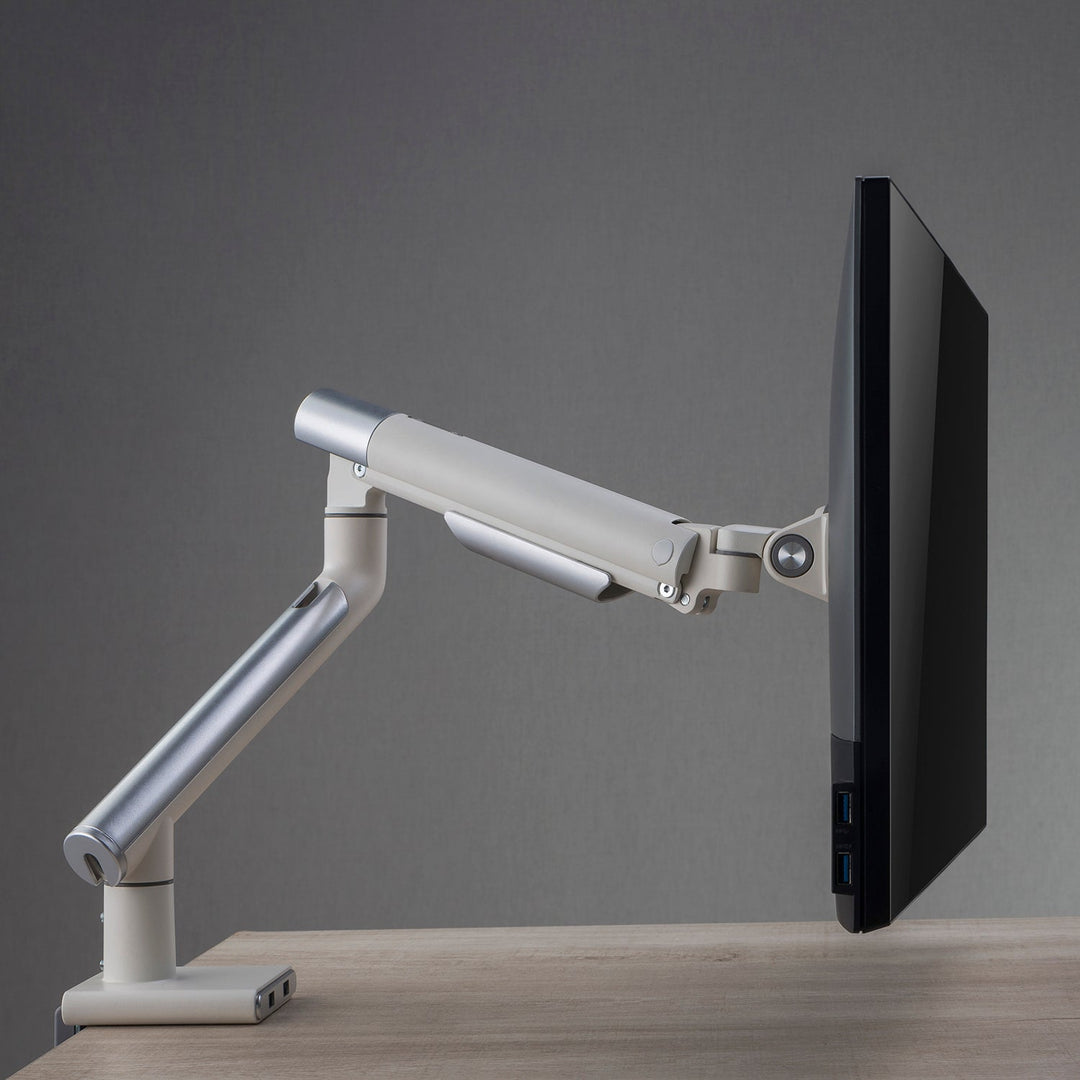 Loft Home monitor arm from the Accessories collection, offering adjustable angles and sleek design, perfect for ergonomic workspace setups.