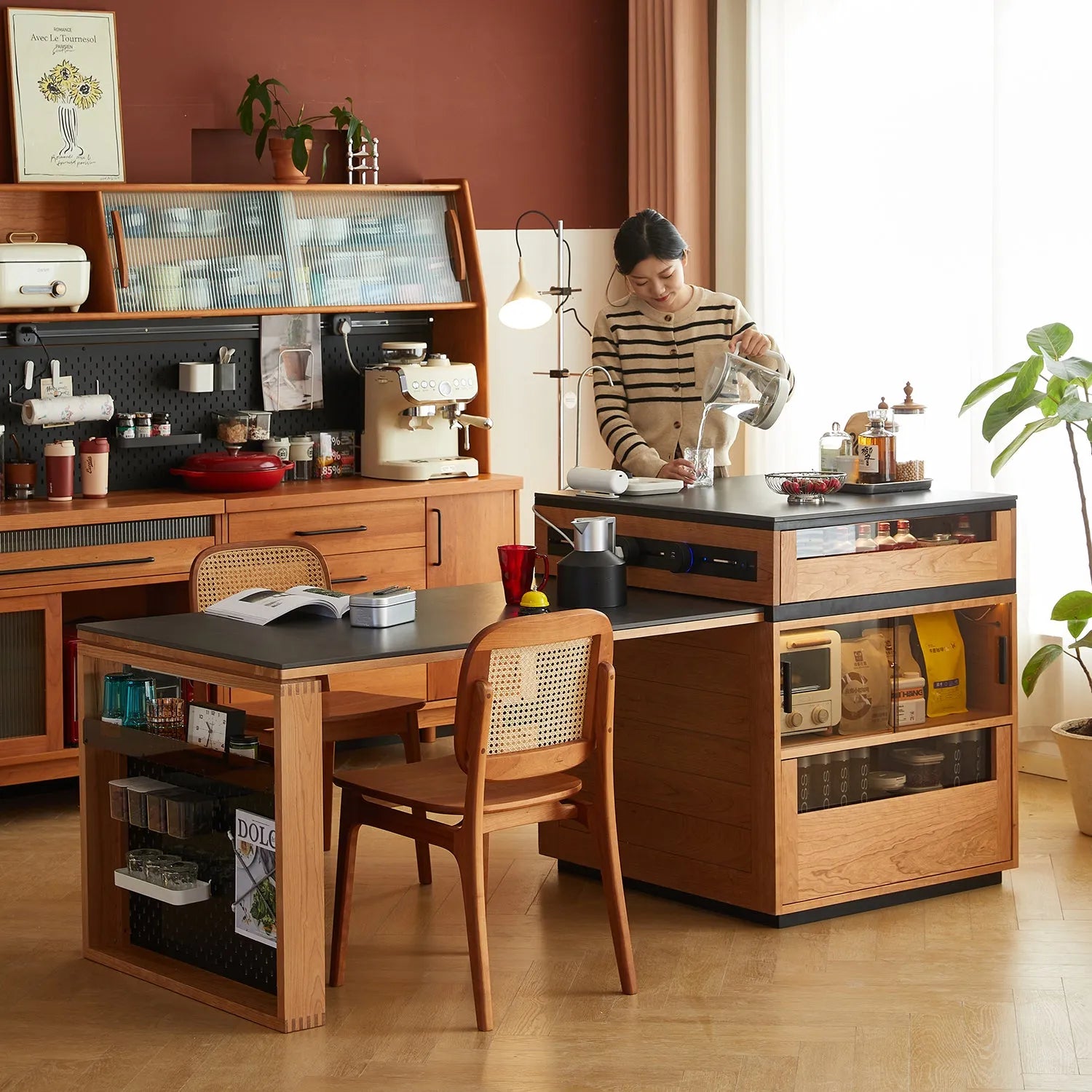 Modern kitchen with a wooden dining table and cabinets, featuring a person preparing a drink. Explore all tables at Loft Home Furniture.