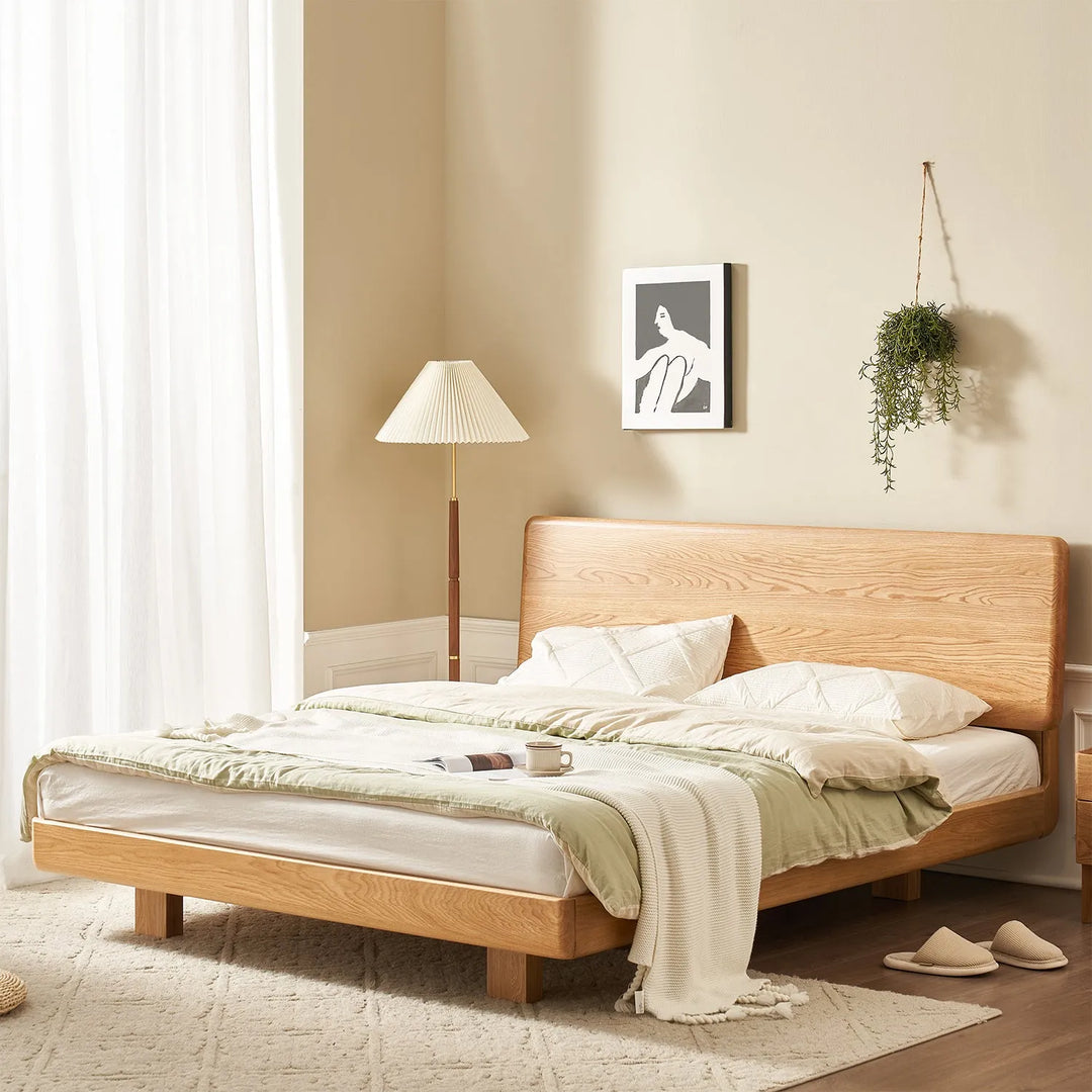 Minimalist bedroom with a wooden bed frame and cozy decor. Explore the bed frame collection at Loft Home Furniture.