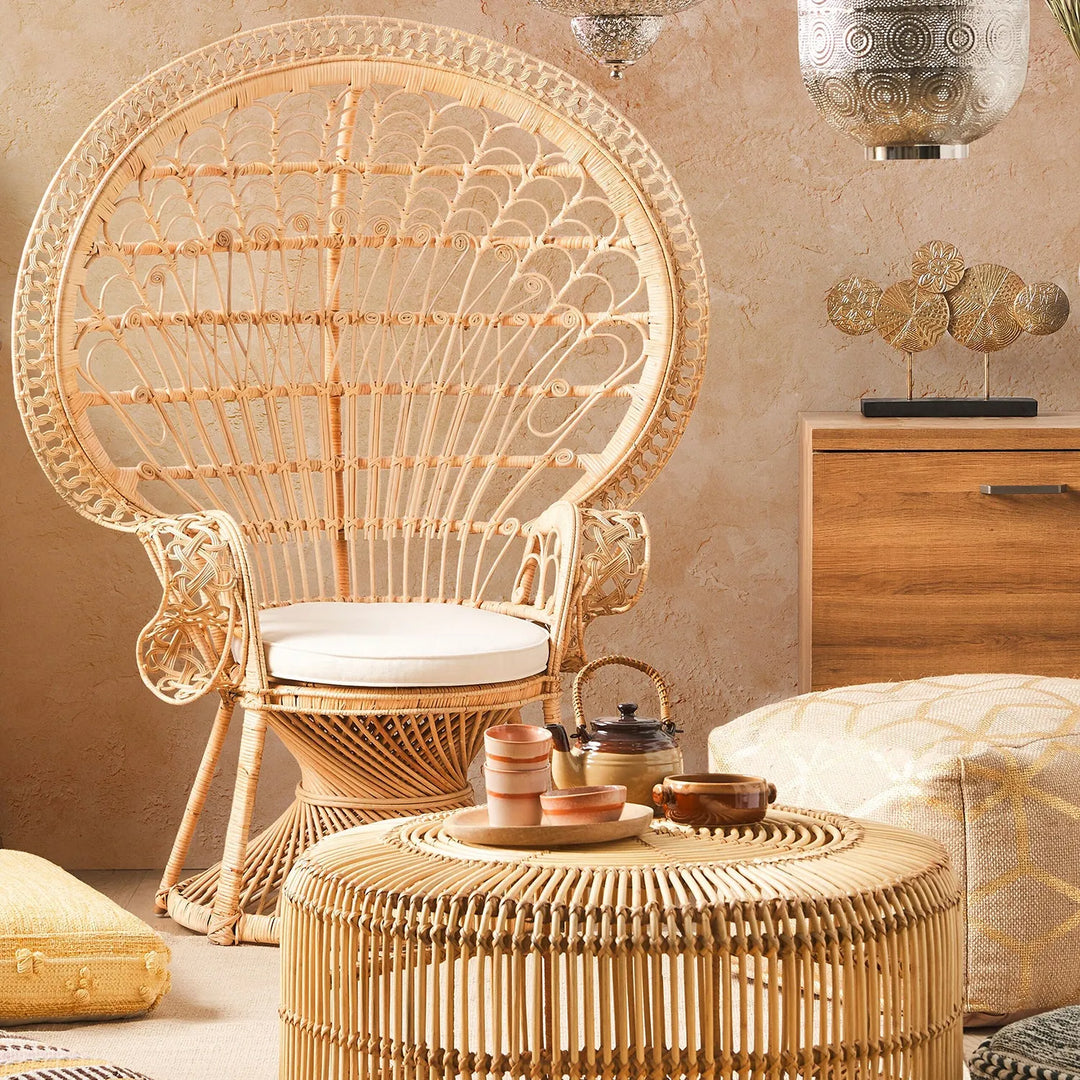 Cover picture for Loft Home's Bohemian Sofas collection: elegant rattan chair with a white cushion and matching coffee table in a cozy, bohemian-inspired living space.