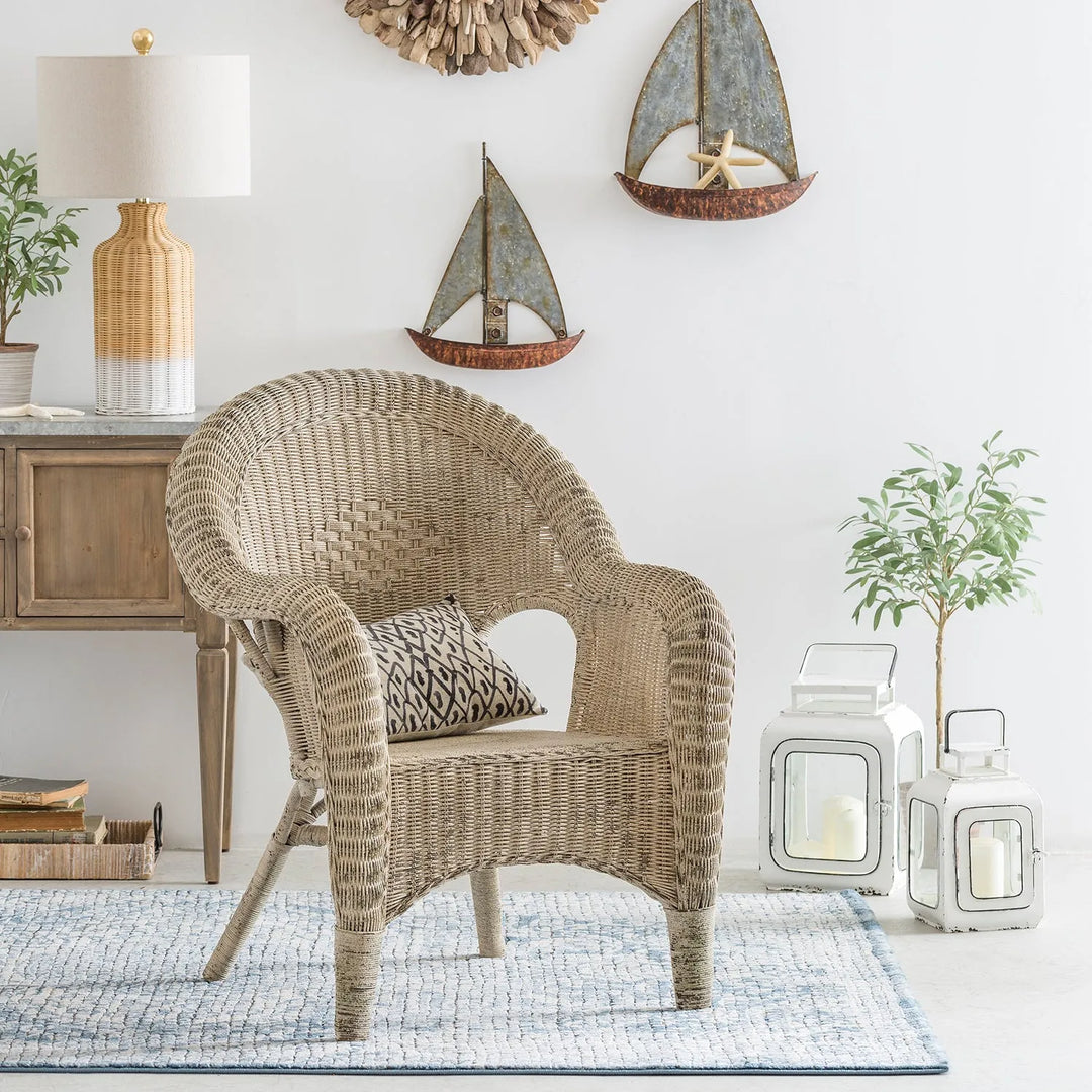 Loft Home bohemian-style room featuring a woven rattan chair, rustic decor, and coastal-inspired accents for a relaxed and airy space.