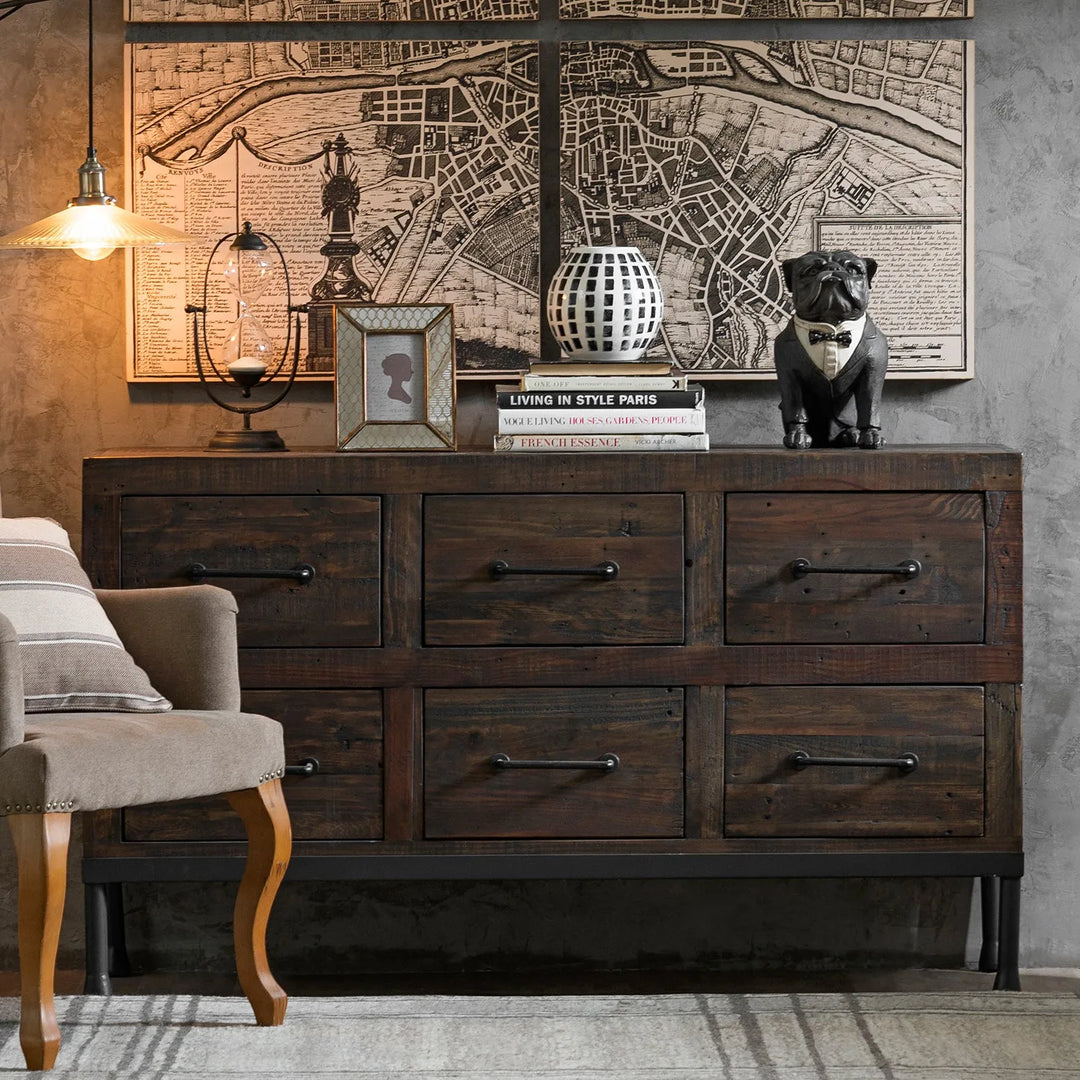 Loft Home rustic dark wood cabinet with vintage decor, including a framed map, decorative bulldog figurine, and stylish lighting in a cozy living space.