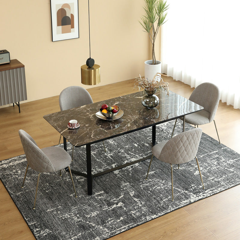 Loft Home Ceramic Tables collection, featuring a sleek black ceramic dining table paired with upholstered chairs, exudes modern sophistication for dining spaces.