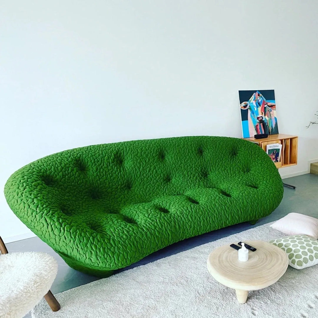 Cover picture for Loft Home's Contemporary Sofas collection: vibrant green tufted sofa in a modern living room with minimalist decor.