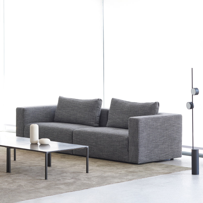 Loft Home Removable Cover Sofas Collection - Sleek gray sofa with removable covers, showcasing a modern minimalist design in a bright, spacious interior