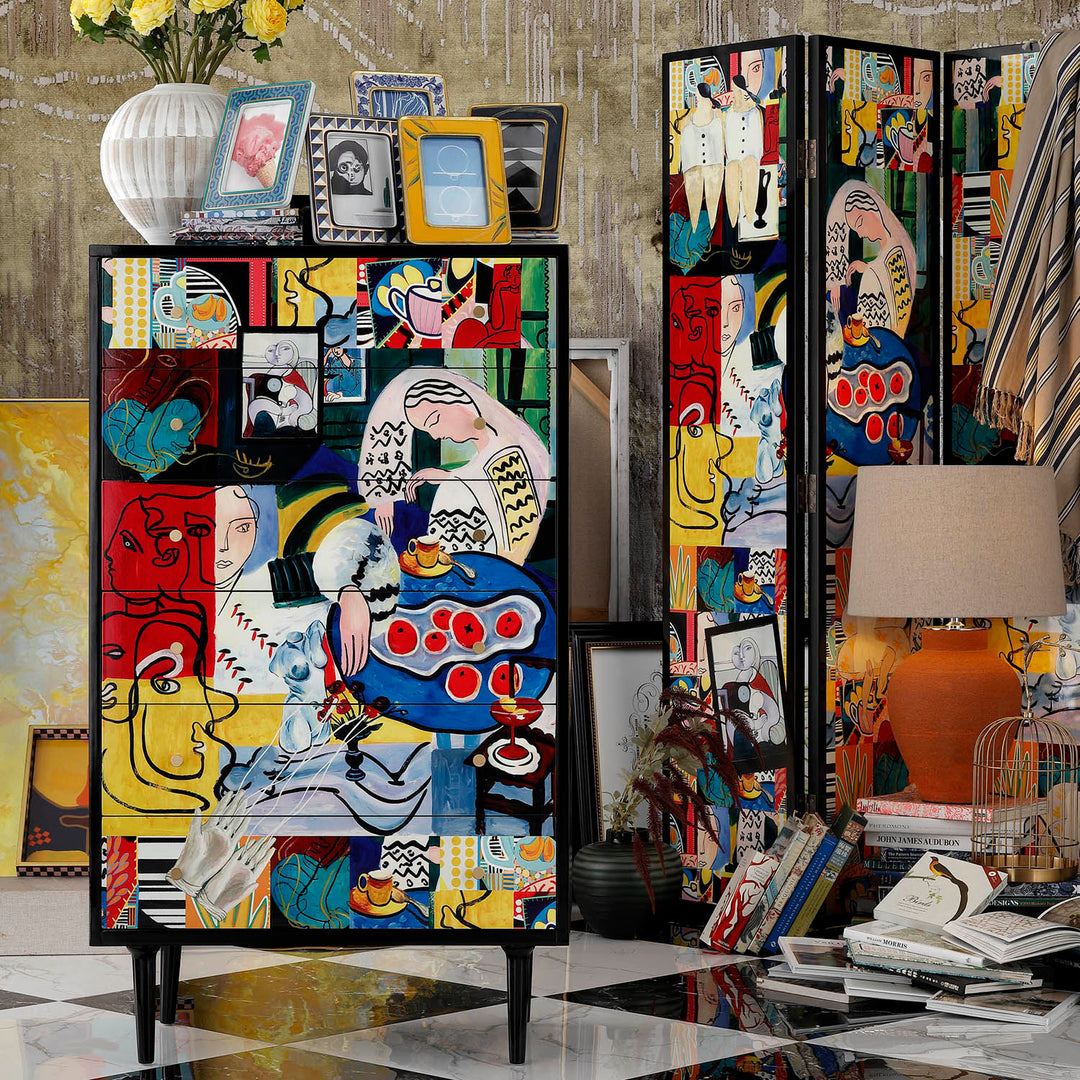 Vibrantly painted eclectic storage cabinet with artistic patterns, styled with framed photos and a bold lamp, adding character to modern interiors.