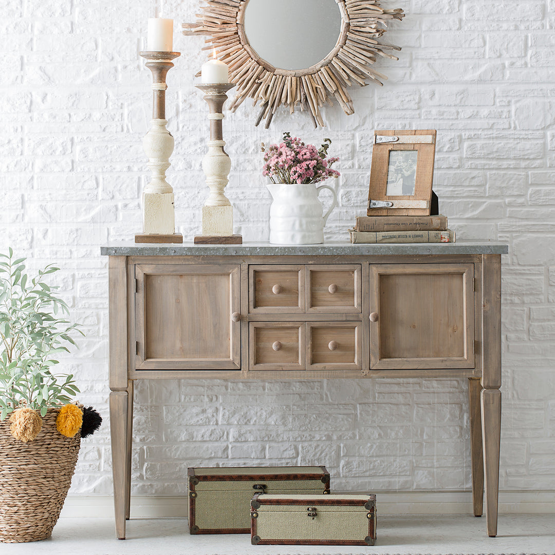 Loft Home rustic wooden console table with vintage decor, candles, and a sunburst mirror, creating a cozy and stylish entrance or living space.