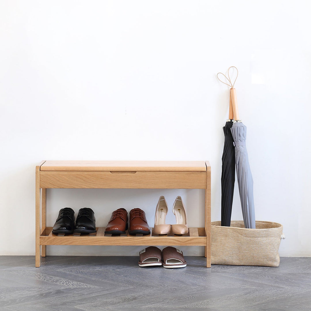 Loft Home entryway bench with integrated shoe storage, styled with neutral tones and practical umbrella holder, enhancing organized and welcoming home entrances.