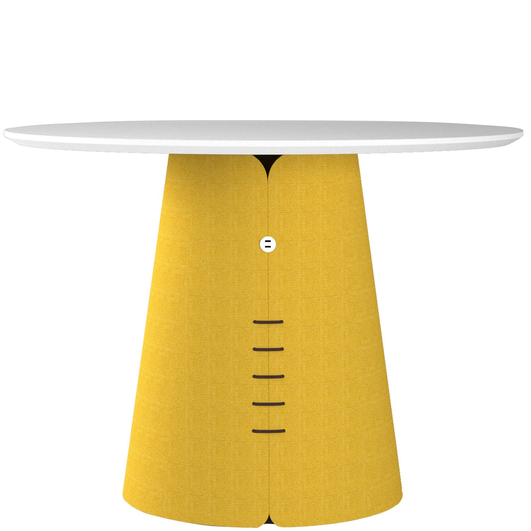Loft Home fabric dining table featuring a unique yellow fabric-wrapped base with a sleek white round tabletop, adding a vibrant and modern touch to dining spaces.
