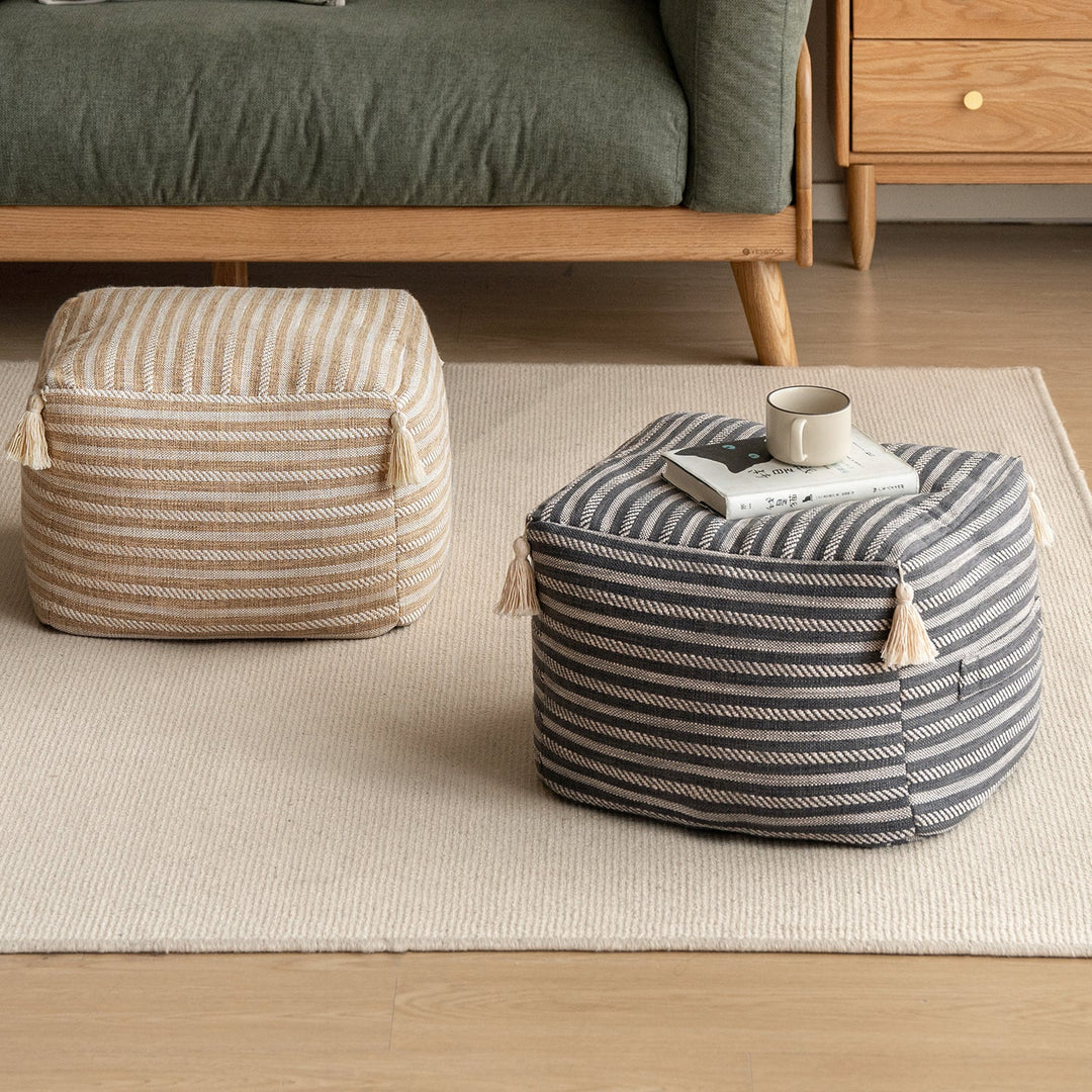 Loft Home striped fabric ottomans in beige and gray with tassel details, part of Fabric Ottomans collection, adding texture and charm to living room decor.