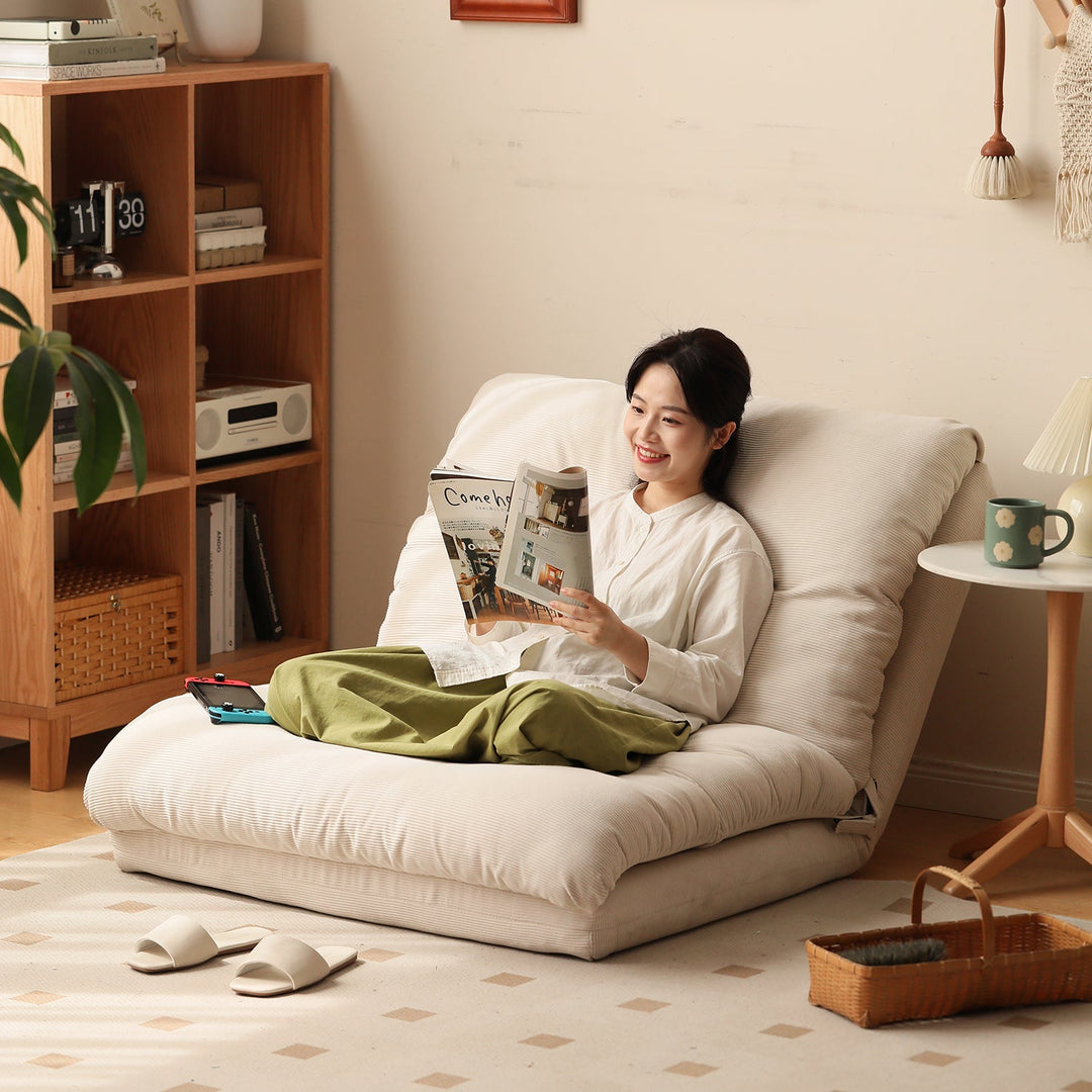 Loft Home foldable sofa bed collection, showcasing a cozy beige foldable sofa bed with a reclining design, perfect for compact spaces and relaxed reading moments.