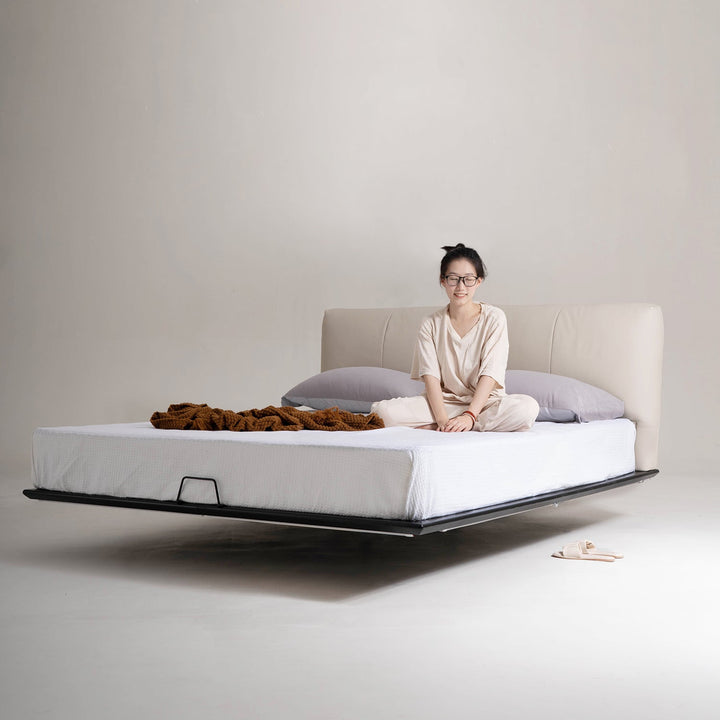 Loft Home floating bed frame with sleek leather headboard and levitating platform, adding a modern and spacious touch to bedroom decor.