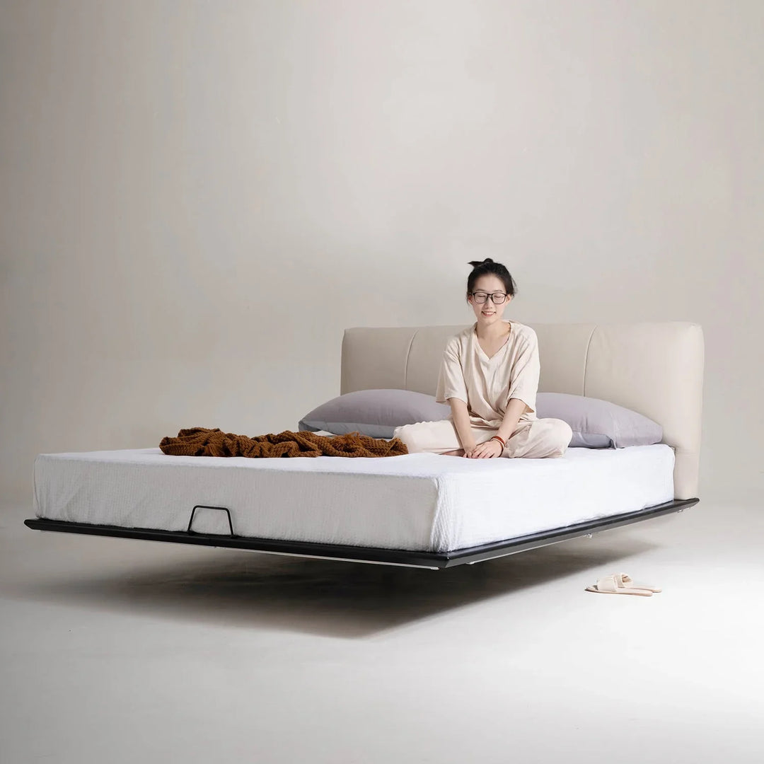 Loft Home floating bed frame with sleek leather headboard and levitating platform, adding a modern and spacious touch to bedroom decor.