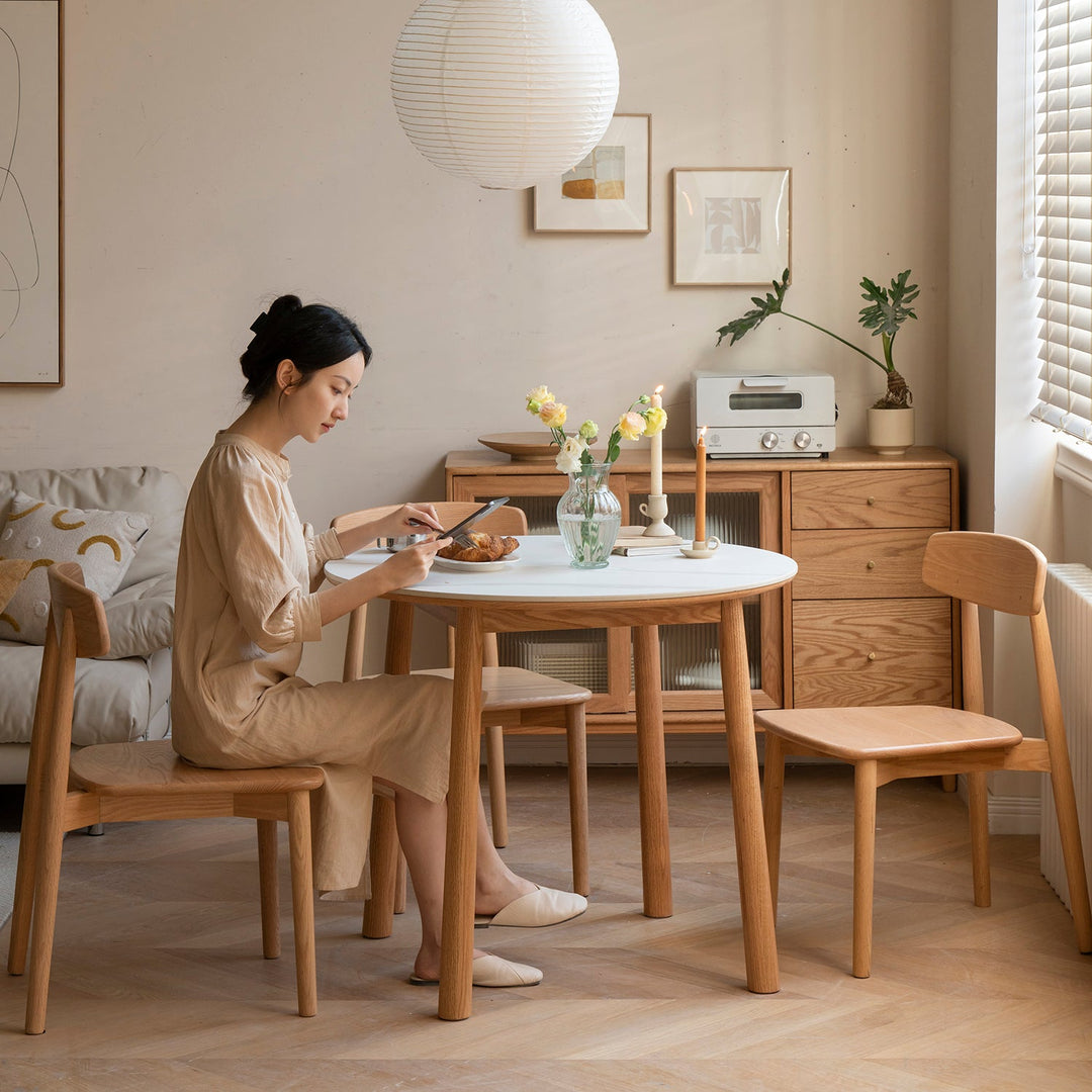 Loft Home holiday storewide sale banner featuring minimalist wooden furniture in a cozy dining setting, perfect for festive celebrations.