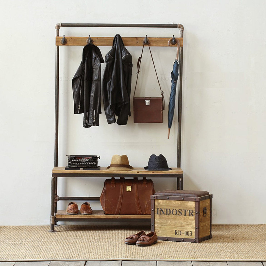 Industrial-style clothes hanger with sturdy metal frame and wooden shelves, perfect for organizing jackets, hats, and shoes in a rustic modern entryway.