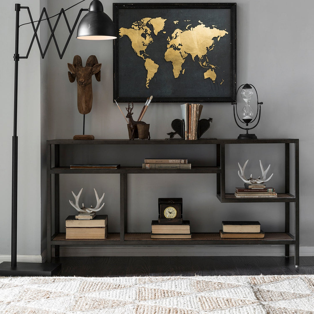 Loft Home industrial storage shelf with a minimalist black metal frame, styled with rustic decor pieces and a gold-accented world map, enhancing modern and functional living spaces.