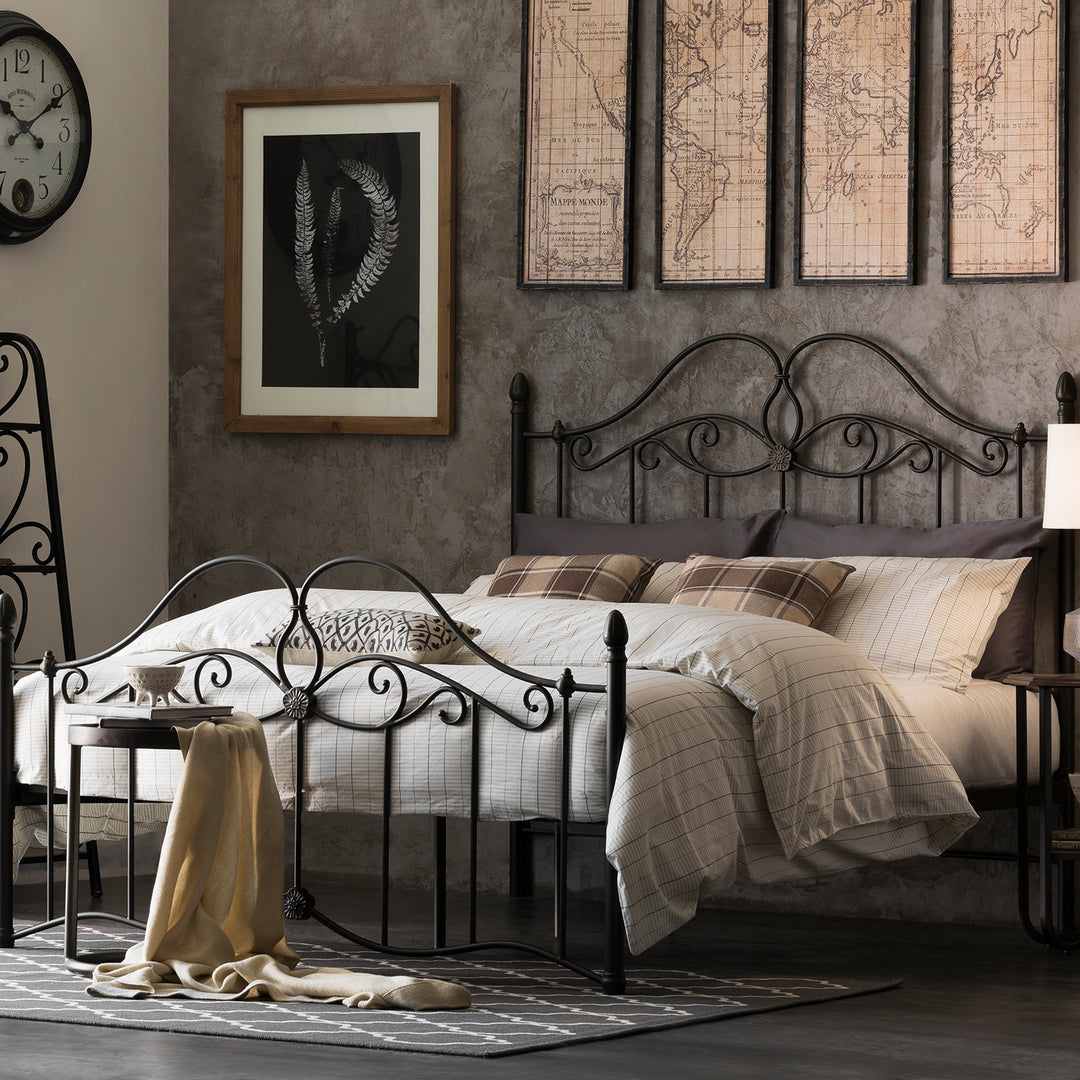 Loft Home industrial-style bedroom featuring a black metal bed frame, vintage decor, and a textured wall for a modern, rustic aesthetic.