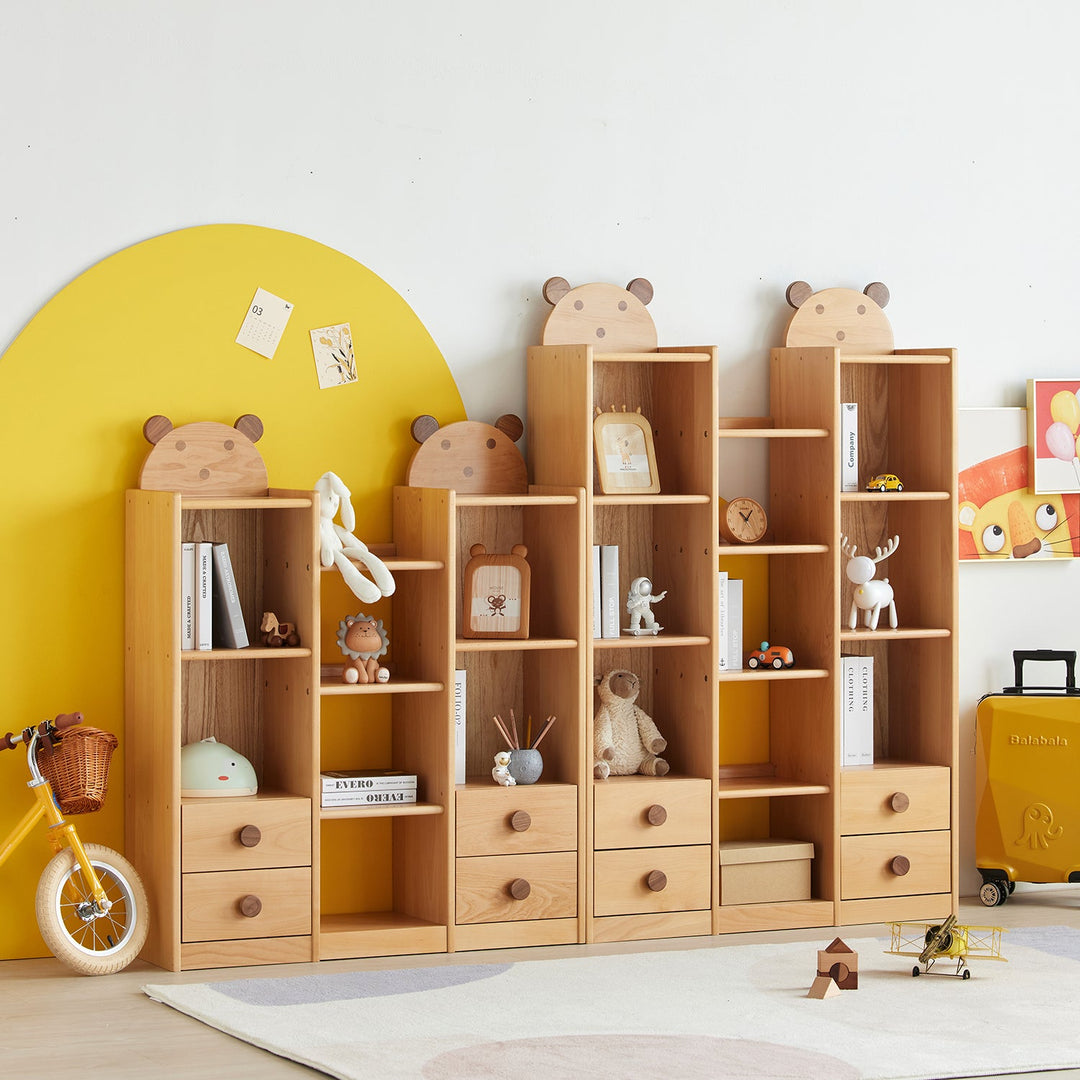 Kids' wooden bookshelves with adorable bear-shaped tops, featuring open shelves and drawers, perfect for organizing books and toys in a playful and functional way.