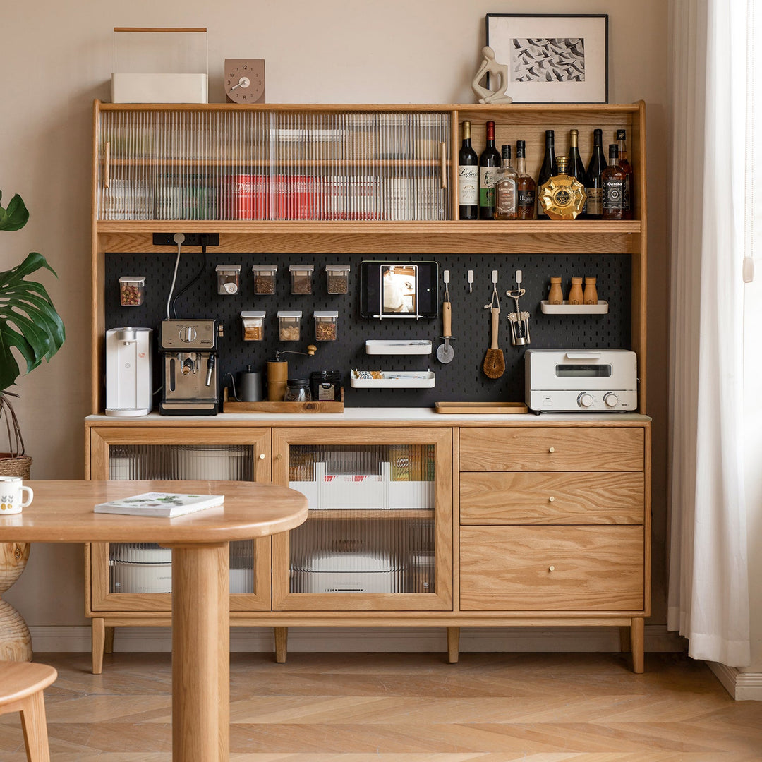 Spacious oak kitchen cabinet with sliding glass doors, integrated pegboard organizer, and multiple compartments for coffee machines, utensils, and storage, perfect for a modern and functional kitchen setup.