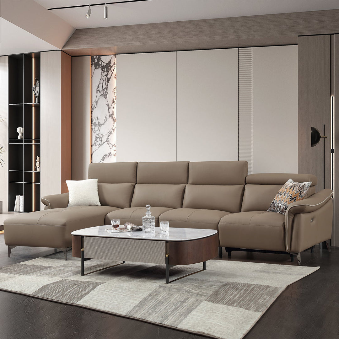 L-shaped recliner sofa in premium leather, featuring adjustable headrests and a spacious chaise, blending luxury and comfort for modern living rooms.