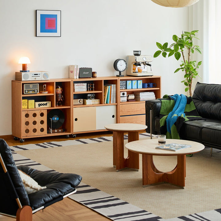 Featured in Loft Home's living room collection: Elegant living room with a cream L-shaped sofa, dark wood coffee table, decorative pillows, horse-themed wall art, and cozy lighting.