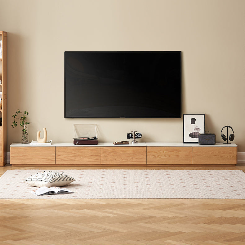 Minimalist wooden TV console with multiple storage drawers and a sleek surface, ideal for organizing living room essentials while adding a touch of sophistication.