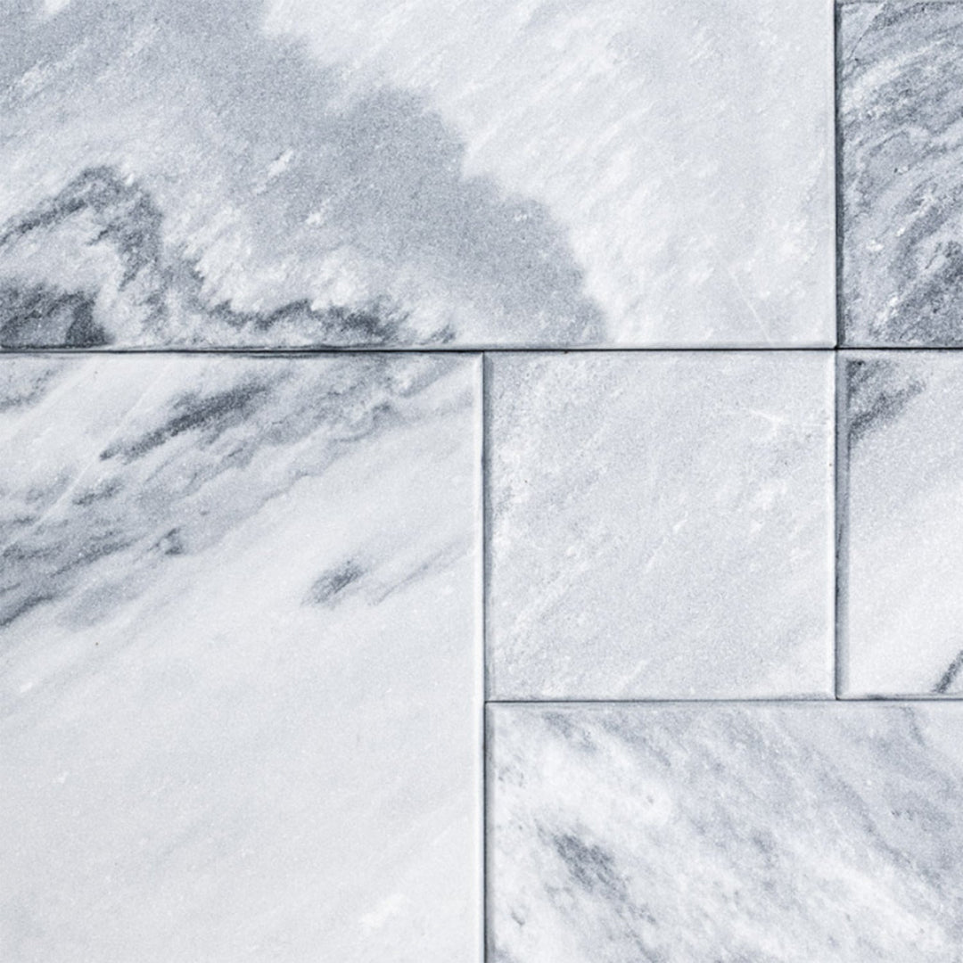 Natural marble surface with soft grey veining and stone texture, adding timeless elegance to modern furniture spaces.