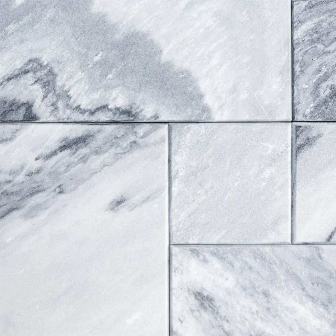 Natural marble surface with soft grey veining and stone texture, adding timeless elegance to modern furniture spaces.