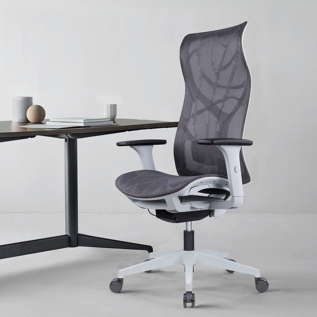 Ergonomic grey mesh office chair with adjustable armrests, lumbar support, and a sleek white base, perfect for modern workspaces to enhance productivity and comfort.