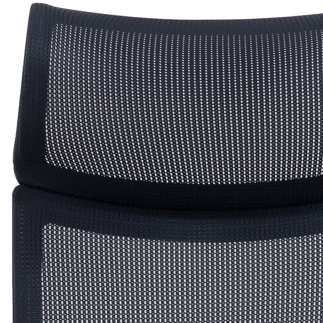 Breathable mesh fabric with fine woven structure, offering lightweight comfort and support for modern seating designs.