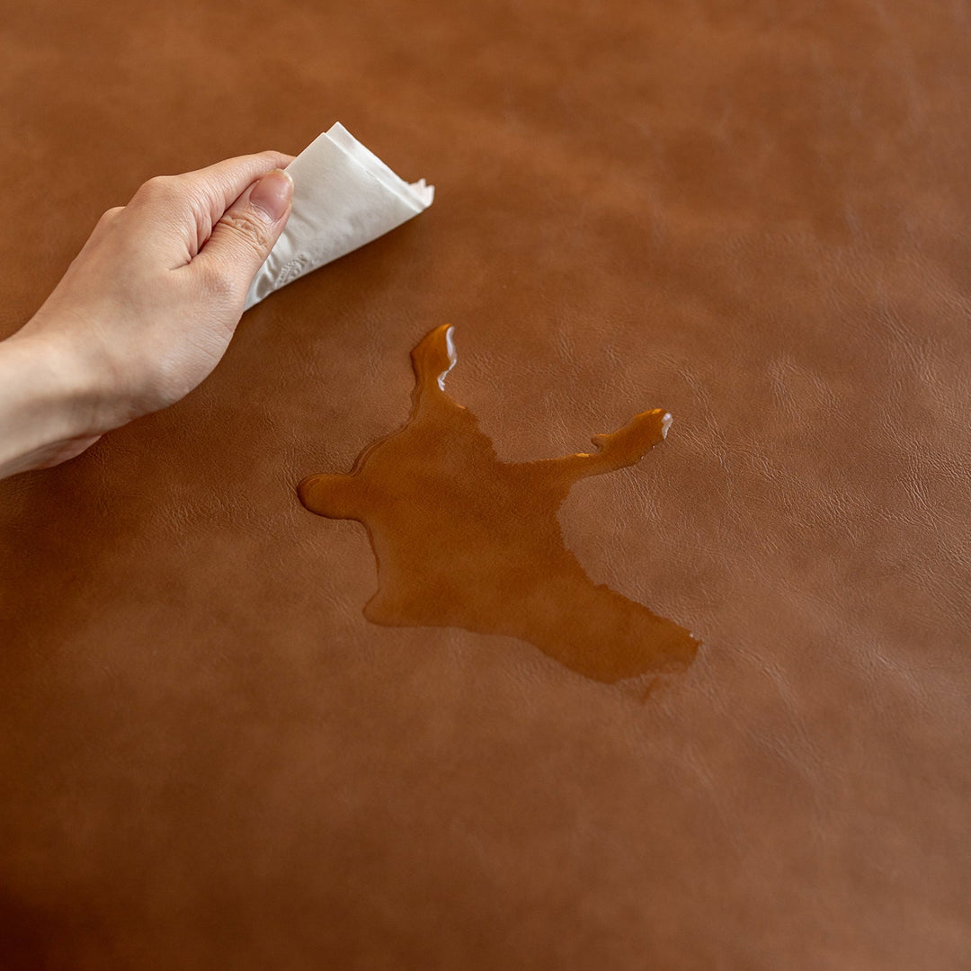 Water-resistant microfiber leather surface, showing easy-clean and durable furniture material designed for modern living by Loft Home.