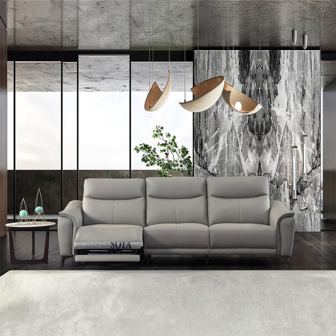 Modern living room featuring a sleek gray recliner sofa, marble accents, contemporary pendant lights, and a minimalist design for a luxurious ambiance.