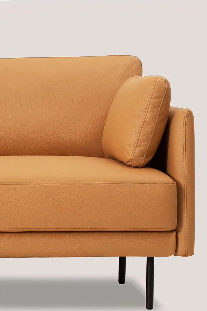 Brown microfiber leather sofa with a single cushion against a light gray background. As a featured product from Loft Home Furniture Singapore microfiber leather sofa.