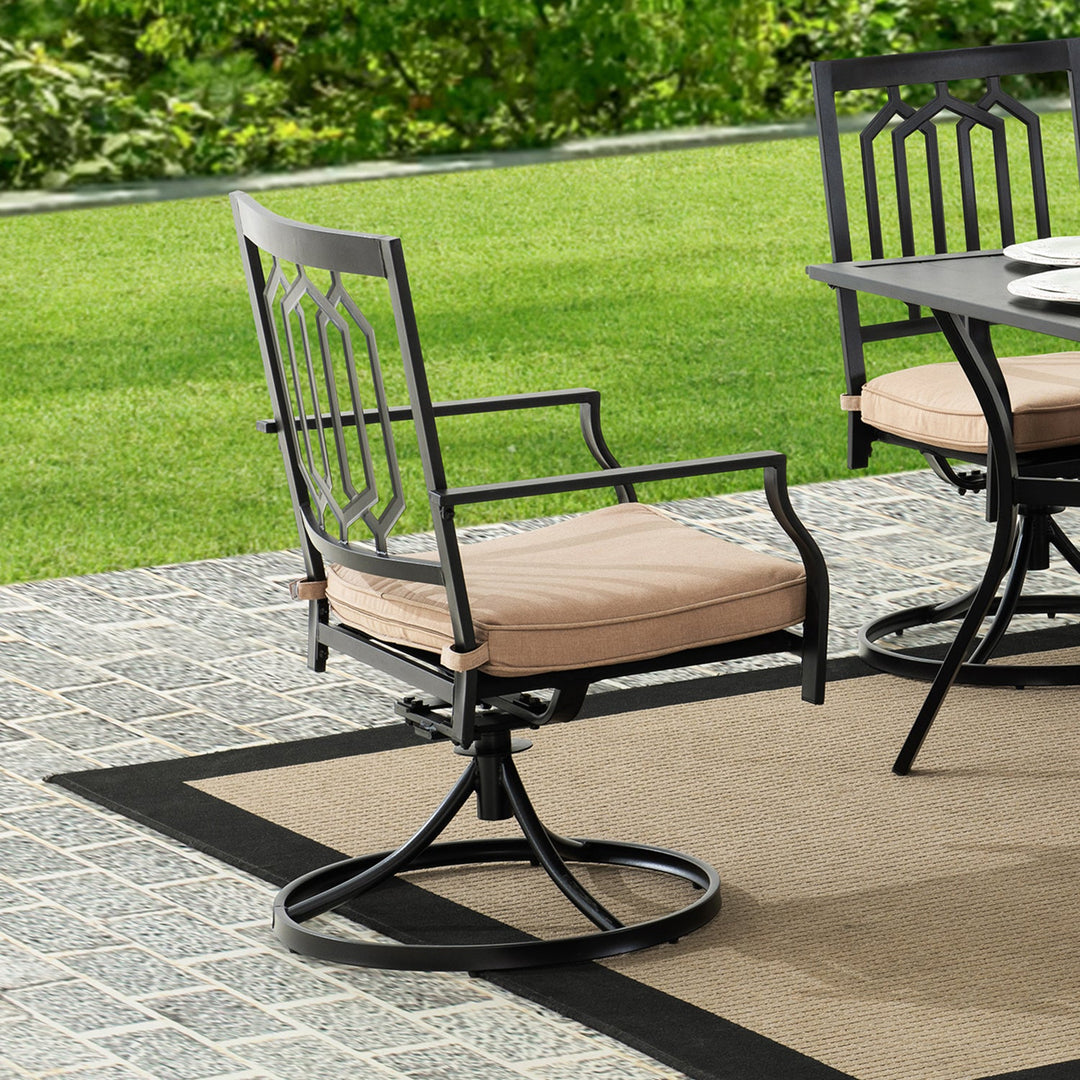 Elegant black metal outdoor dining chair with beige cushions, blending comfort and style, perfect for patios and garden dining settings.