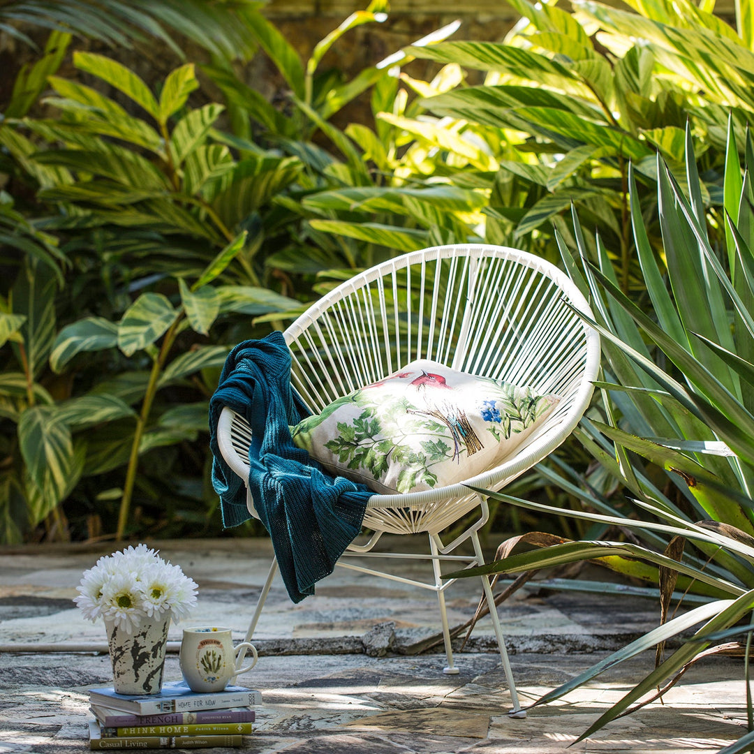 Loft Home outdoor sofa chair with a modern white frame and botanical cushion, creating a relaxing vibe for garden or patio settings in the Outdoor Sofa Chairs collection.