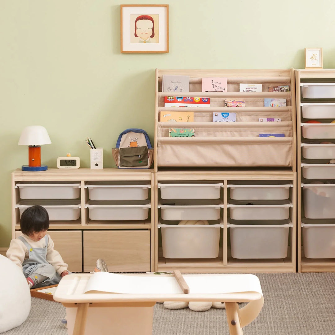 Children’s room with plastic storage cabinets, bookshelves, a cozy play area, and soft lighting, designed to keep the space organized and playful.