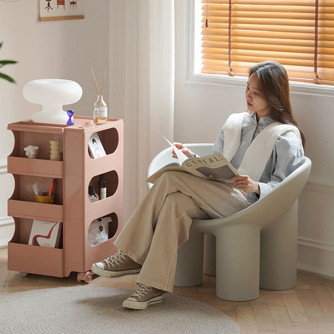 Loft Home Plastic Sofas Collection - Stylish minimalist plastic armchair paired with a compact pink storage trolley, ideal for modern and versatile living spaces