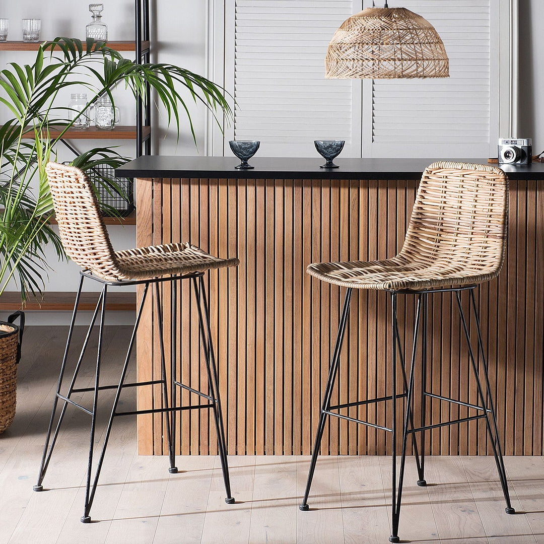 Rustic rattan bar chairs with metal frames, featuring woven seats and backs, perfect for tropical-themed bar counters or kitchen islands.