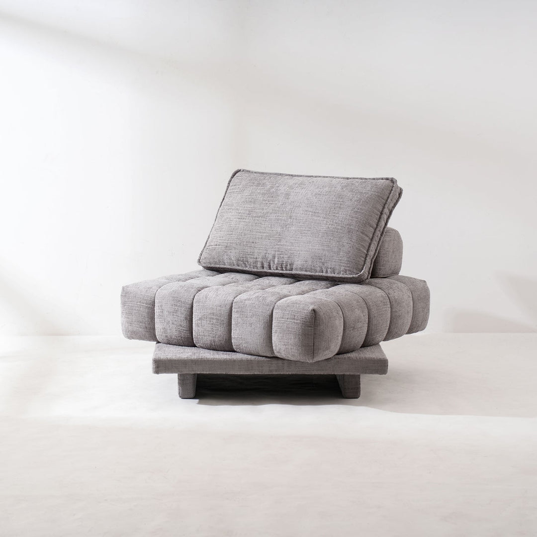 Loft Home revolving sofa with a modern tufted gray cushion design, offering versatile comfort and style, perfect for contemporary living spaces.