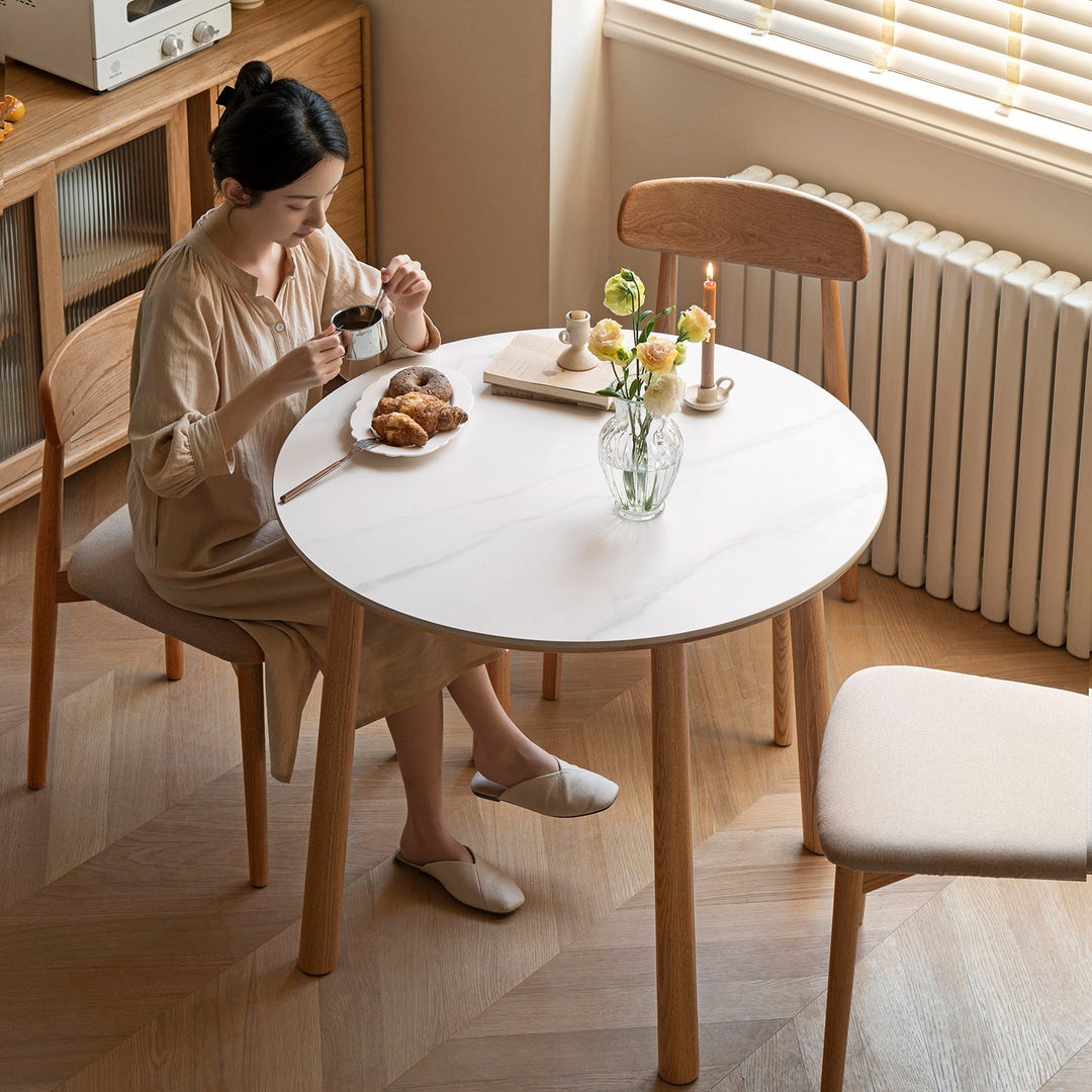 Loft Home round dining table from the Round Tables collection, crafted with a sleek marble finish, ideal for compact spaces and elegant dining setups.