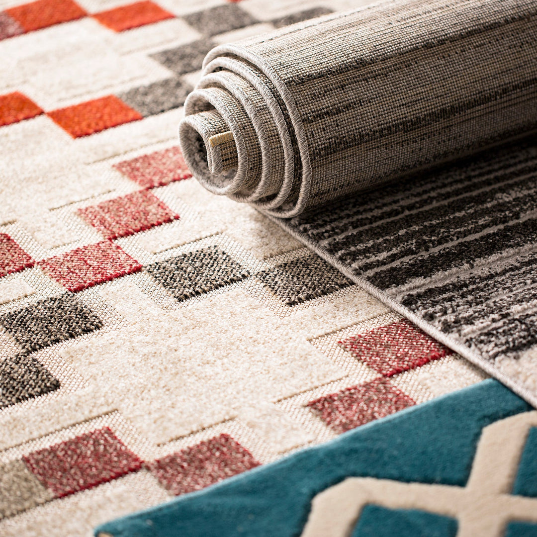 Assorted rugs with geometric and textured patterns in warm tones, showcasing versatile designs for modern and cozy home interiors.