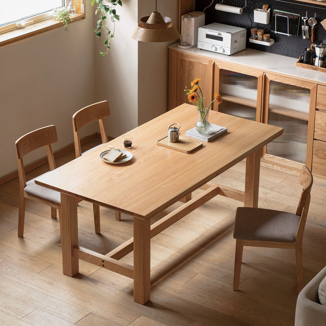 Loft Home Scandinavian dining table collection, featuring a minimalist solid wood dining table with matching chairs, styled in a bright and cozy kitchen setting for functional elegance.